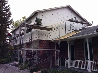 Exterior by design team working on exterior stucco
